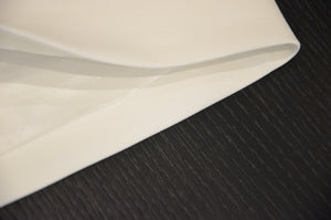 
                  
                    a close up of a piece of paper on a table 
                  
                