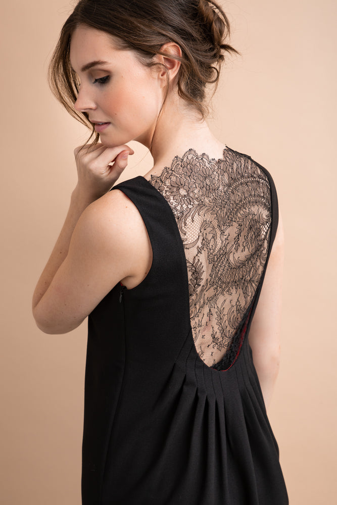
                  
                    a woman wearing a black and white dress 
                  
                