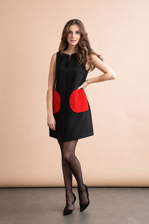 
                  
                    a woman in a black dress standing on a floor 
                  
                
