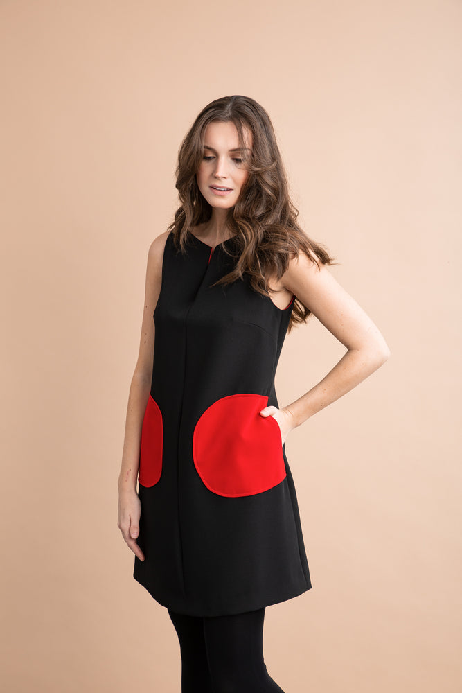 
                  
                    a woman in a red dress holding a tennis racquet 
                  
                