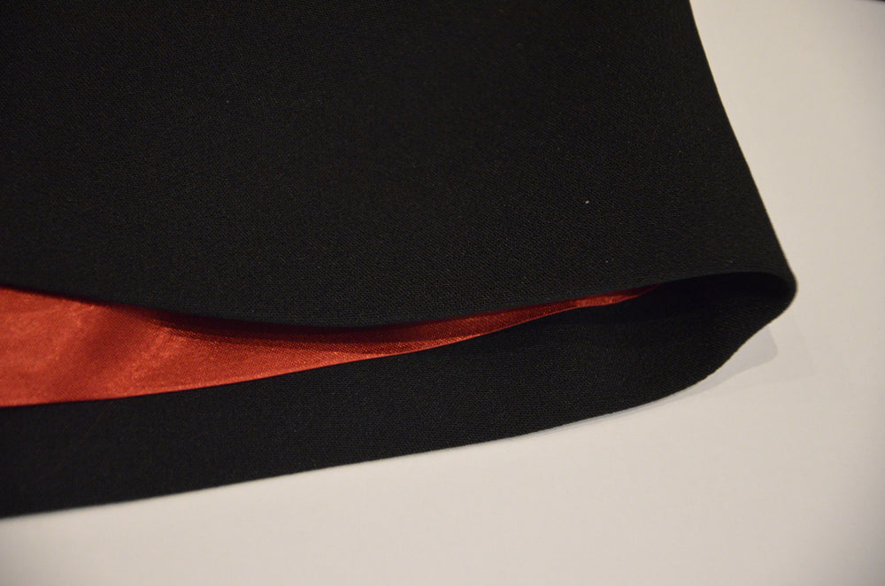 
                  
                    a close up of a black and red umbrella 
                  
                