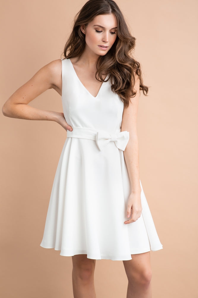 
                  
                    a woman in a white dress in a white dress 
                  
                